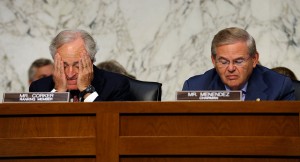 Senate Foreign Relations Committee Chairman Sen. Robert Menendez, D-N.J., right, and the committee's ranking Republican Sen. Bob Corker, R-Tenn. listen on Capitol Hill in Washington, Wednesday, Sept. 4, 2013, during the committee's hearing to consider the authorization for use of military force in Syria. (AP Photo/Susan Walsh)