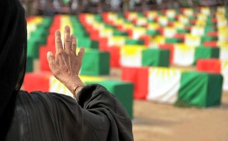 A Kurdish woman survivor of the Anfal genocide campaign greets the remains of Anfal victims returned to the Kurdistan Region after more than two decades.